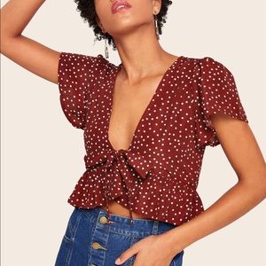 Polka dot ruffle hem tie blouse